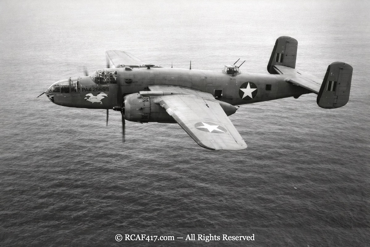 A B-25 Mitchell named or marked with a Pegasus emblem, serial PAA 2565, in flight over water
