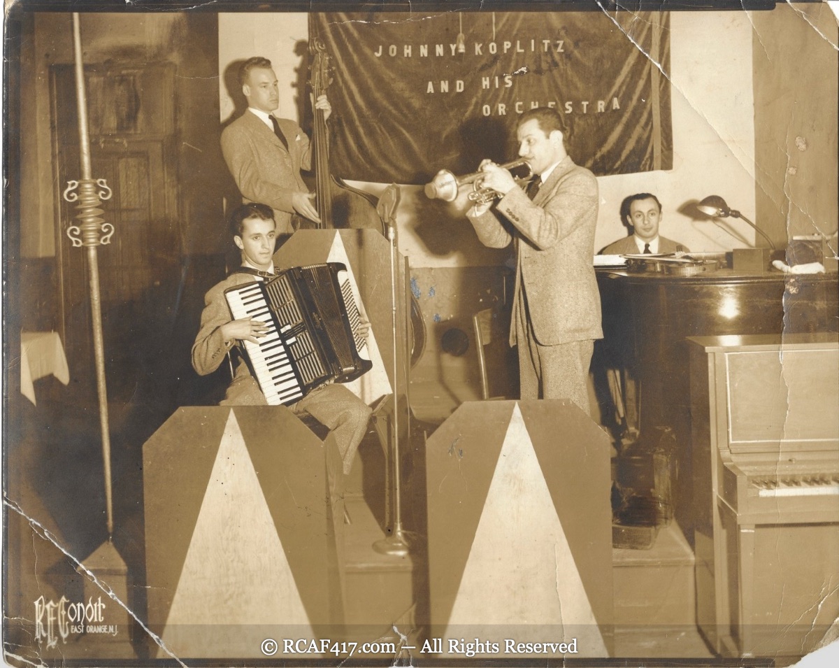 Johnny Koplitz and His Orchestra performing on stage
