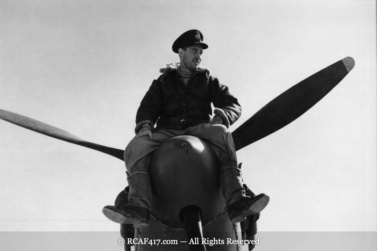 417 Squadron pilot on the nose of his Spitfire