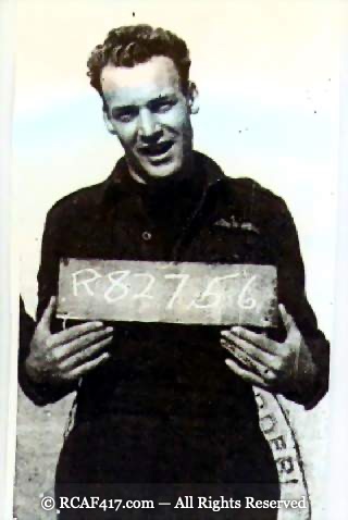 John Koplitz holding a slate board with his RCAF service number R82756
